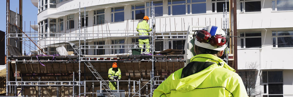 Scaffolding photo showing scaffolders working on building wearing safety clothing